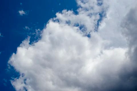 White clouds on a blue sky. Background. Stock Photos