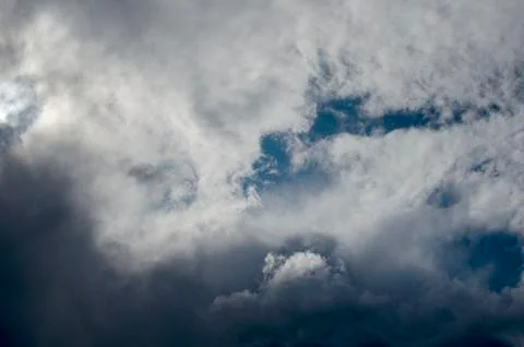 White clouds on a blue sky. Background. Stock Photos