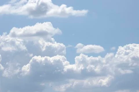 White clouds on a blue sky. Background. Stock Photos
