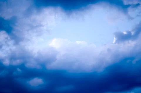 White clouds on a blue sky. Background. Stock Photos