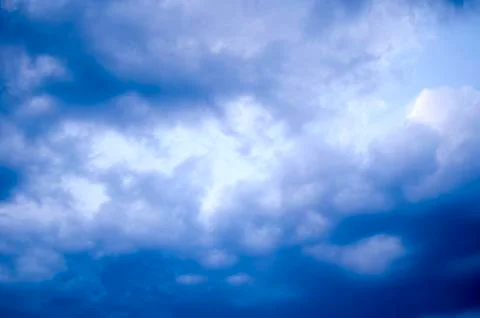 White clouds on a blue sky. Background. Stock Photos