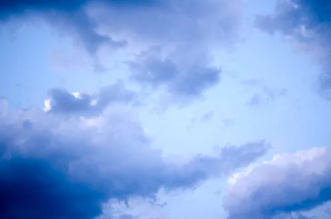 White clouds on a blue sky. Background. Stock Photos