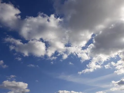 White clouds on a blue sky. Background. Stock Photos