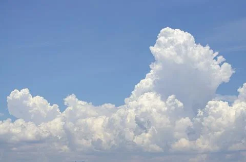 White clouds in the blue sky background and texture. Stock Photos