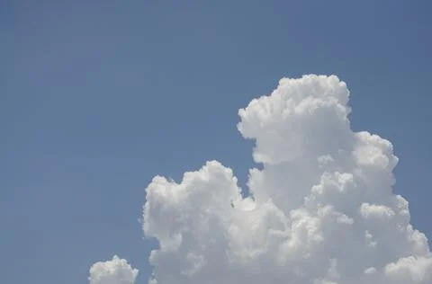 White clouds in the blue sky background and texture. Stock Photos
