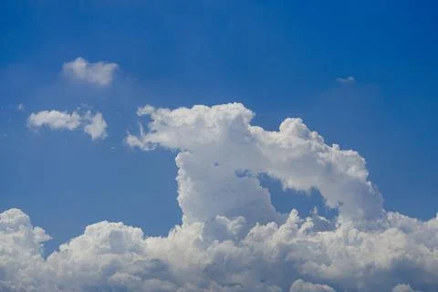 White clouds in the blue sky background and texture. Stock Photos