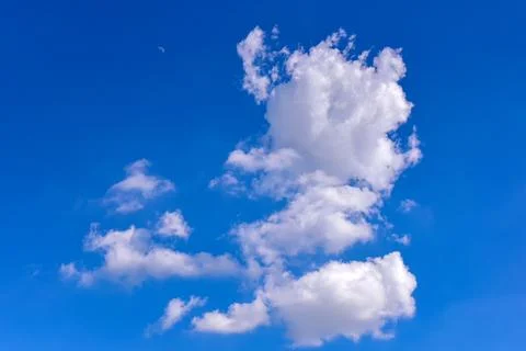 White clouds on blue sky background. Stock Photos