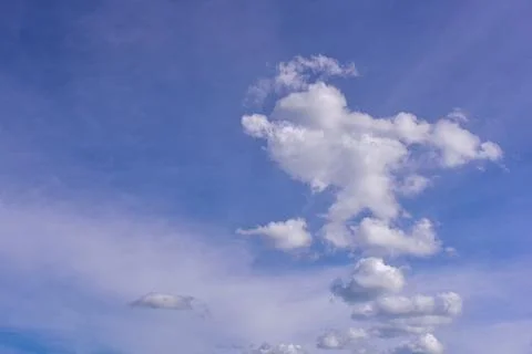 White clouds on blue sky background. Stock Photos
