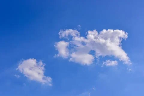 White clouds on blue sky background. Stock Photos