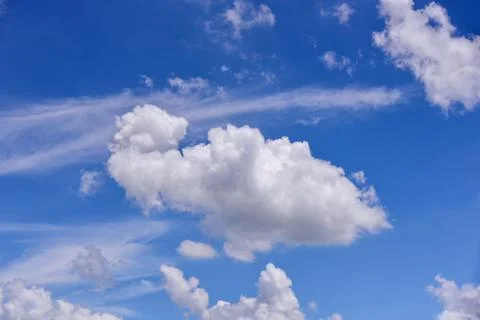 White clouds on blue sky background. Stock Photos