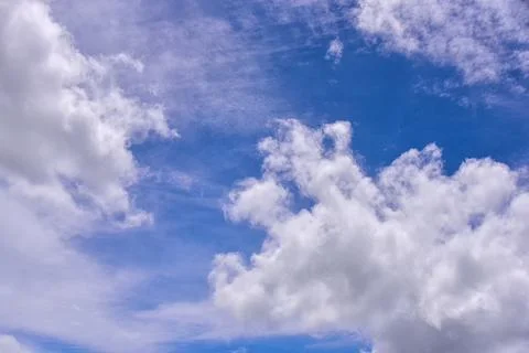White clouds on blue sky background. Stock Photos