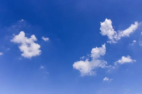 White clouds on blue sky background. Stock Photos