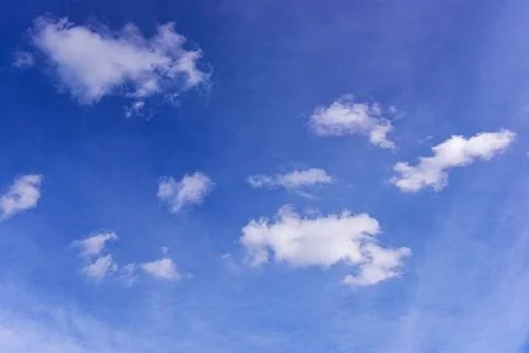 White clouds on blue sky background. Stock Photos