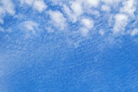 White clouds in blue sky, background. Altocumulus cloud formation Stock Photos
