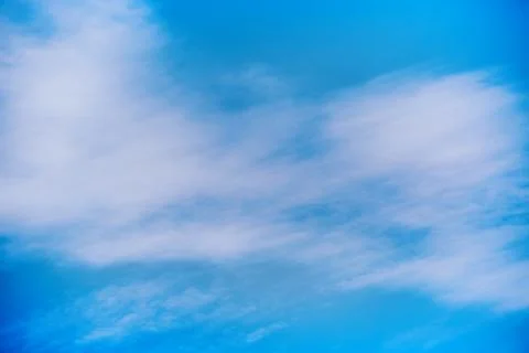 White clouds in the blue sky, close-up of clouds in the blue sky, light on th Stock Photos