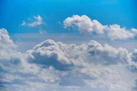 White clouds in the blue sky, close-up of clouds in the blue sky, light on th Stock Photos
