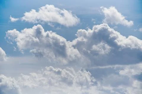 White clouds in the blue sky, close-up of clouds in the blue sky, light on th Stock Photos