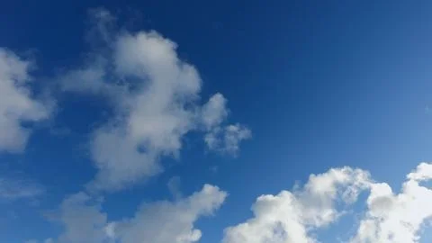 White clouds on a blue sky in cold winter day Stock Photos