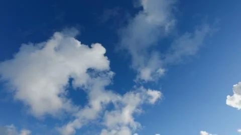 White clouds on a blue sky in cold winter day Stock Photos