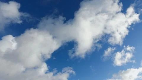 White clouds on a blue sky in cold winter day Stock Photos