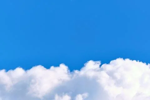 White clouds in the blue sky copy space. Stock Photos