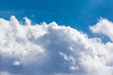 White Clouds Blue Sky Fluffy Sun Flare Airplane Trail  Sunny Daytime Texture  Stock Photos