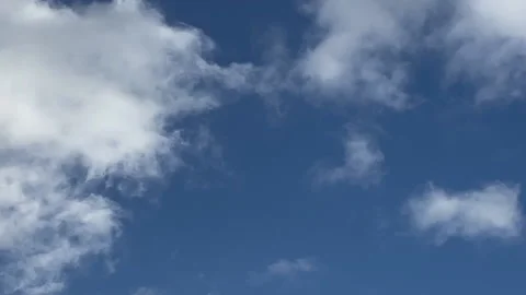 White Clouds on a Blue Sky Stock Footage 169437748