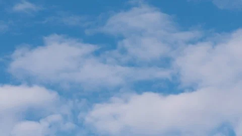 White clouds at the blue sky (horizontal moving) Stockbeeldmateriaal 117974292