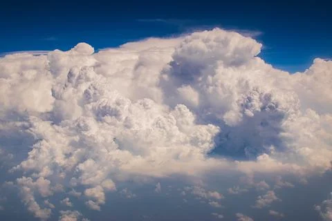 White clouds in blue sky Image shot from flying aeroplane , cloudscape of Ind Stockfoto's