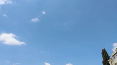 White clouds in a blue sky move fast Stock Footage 156080410