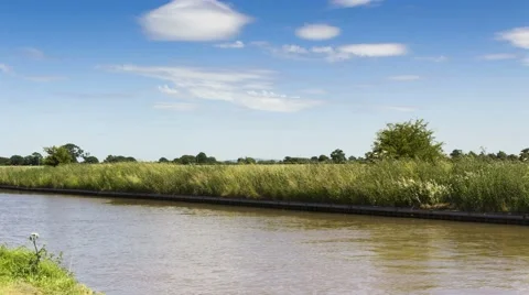 White clouds in blue sky over Shropshire canal in Cheshire 4K Timelapse Video stock 52007816