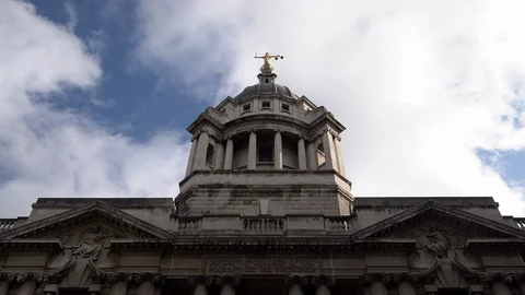 White clouds in a blue sky pass over the Old Bailey Central Criminal Court Stock Footage 119447940
