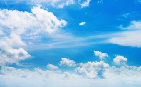 White clouds in blue sky Stock Photos