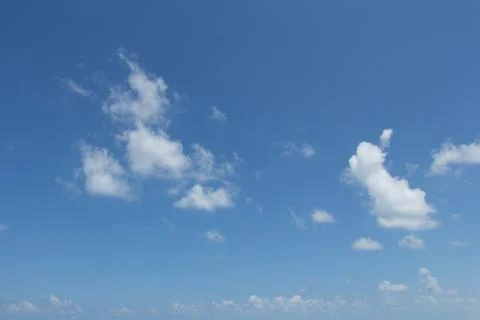 White clouds in the blue sky. Stock Photos