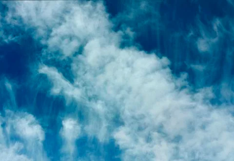 White clouds on a blue sky Stock Photos