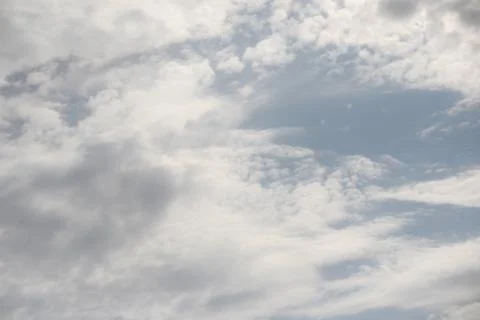 White clouds in the blue sky. Stock Photos