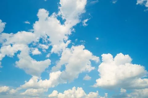 White clouds on the blue sky Stock Photos