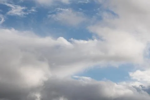 White clouds on a blue sky  Stock Photos