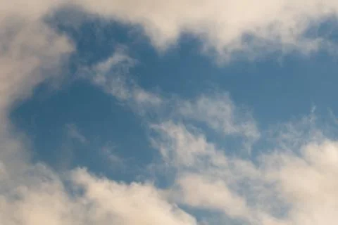 White clouds on a blue sky Stock Photos