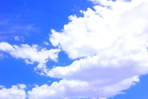 White clouds on a blue sky Stock Photos