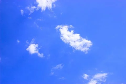 White clouds on a blue sky Stock Photos