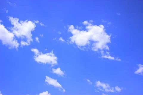 White clouds on a blue sky Stock Photos