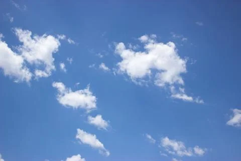 White clouds on a blue sky Stock Photos