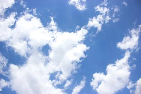 White clouds on a blue sky Stock Photos