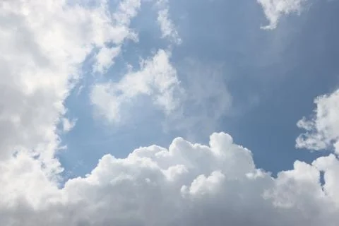White clouds in the blue sky. Stock Photos