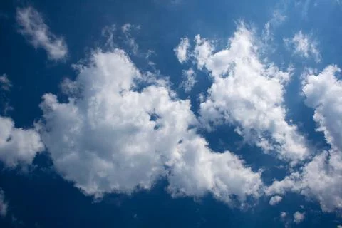 White clouds on the blue sky Stock Photos