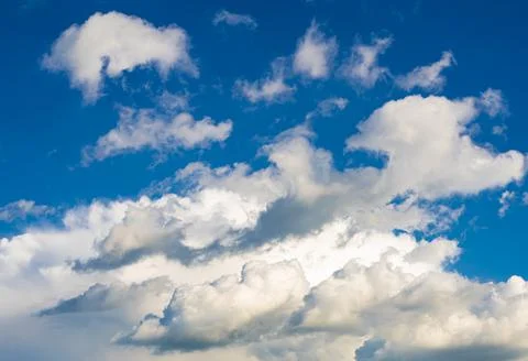 White clouds on the blue sky Stock Photos