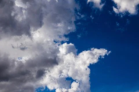 White clouds in a blue sky Stock Photos