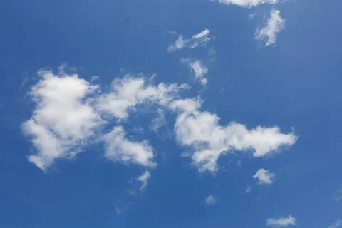 White clouds in a blue sky Stock Photos