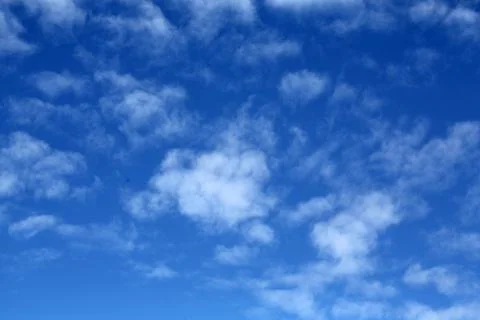 White clouds on the blue sky Stock Photos